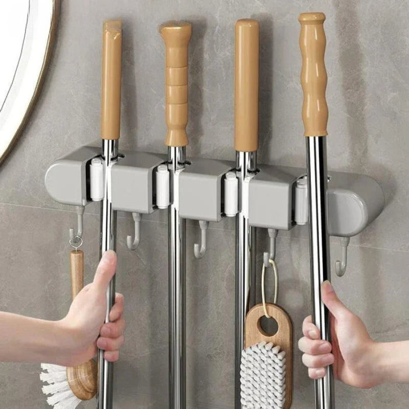 Supporto a muro versatile per attrezzi domestici