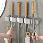 Supporto a muro versatile per attrezzi domestici
