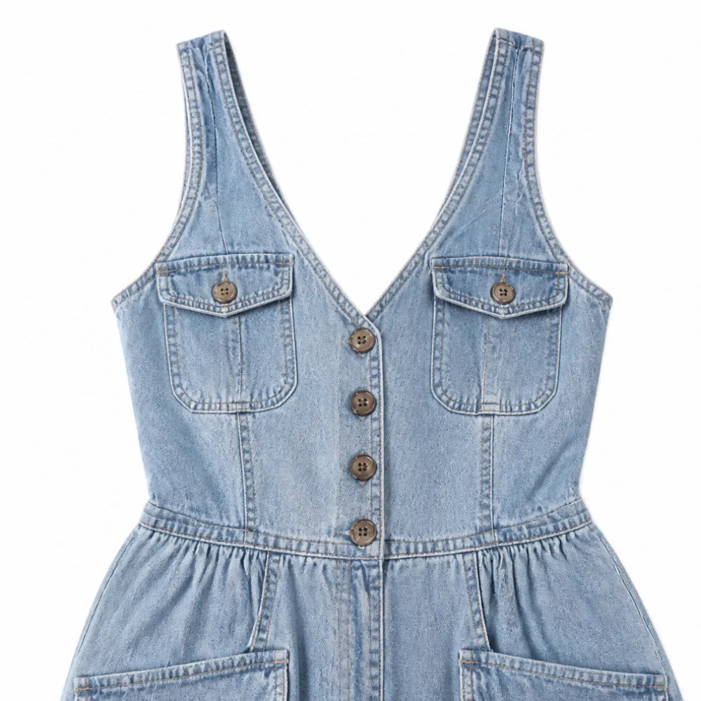 Ellora – Salopette in denim a gamba larga con bottoni frontali e tasche