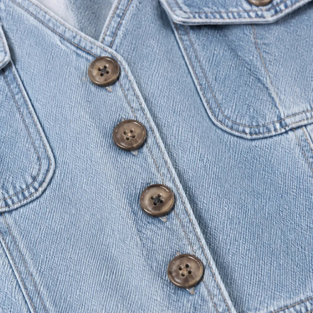 Ellora – Salopette in denim a gamba larga con bottoni frontali e tasche
