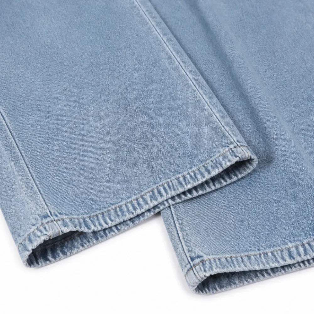 Ellora – Salopette in denim a gamba larga con bottoni frontali e tasche