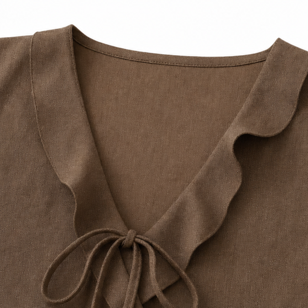 Vellara – Blusa senza maniche con rouches e scollo a V con fiocco e orlo peplum