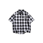 Camicia a maniche corte a scacchi nera e bianca da uomo